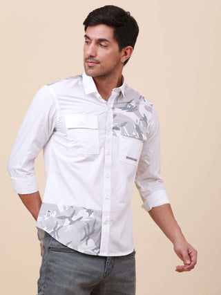 White Camo Solid Single Pocket Shirt shop online at Estilocus. 100% Cotton ,Full-sleeve solid shirt Cut and sew placket. Cut and sew front placket with camo fab Regular collar Double button edge cuff Double pocket with flap Curved bottom hemline Finest pr