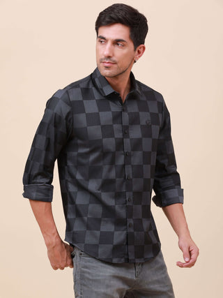 Dark Grey Check Pocketless Shirt shop online at Estilocus. 100% Cotton ,Full-sleeve checks shirt Self fold placket Regular collar Double button edge cuff Pocketless Curved bottom hemline Finest quality brand embroidery at front placket. All sinlge needle