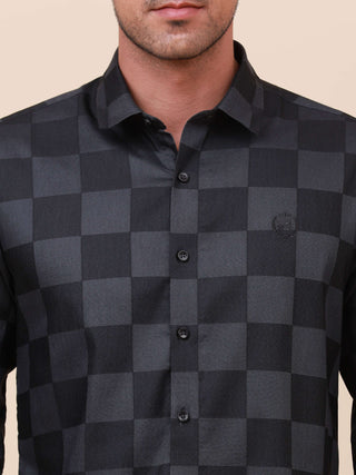 Dark Grey Check Pocketless Shirt shop online at Estilocus. 100% Cotton ,Full-sleeve checks shirt Self fold placket Regular collar Double button edge cuff Pocketless Curved bottom hemline Finest quality brand embroidery at front placket. All sinlge needle