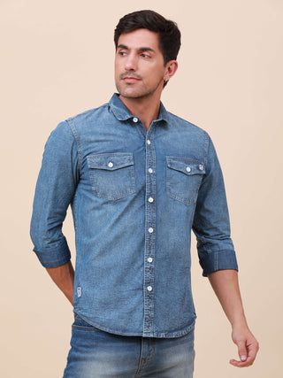 Denim Double Pocket Shirt shop online at Estilocus. Denim, Full-sleeve solid shirt Cut and sew placket Regular collar Double button edge cuff Double pocket with flap Curved bottom hemline All double needle construction, finest quality sewing Machine wash