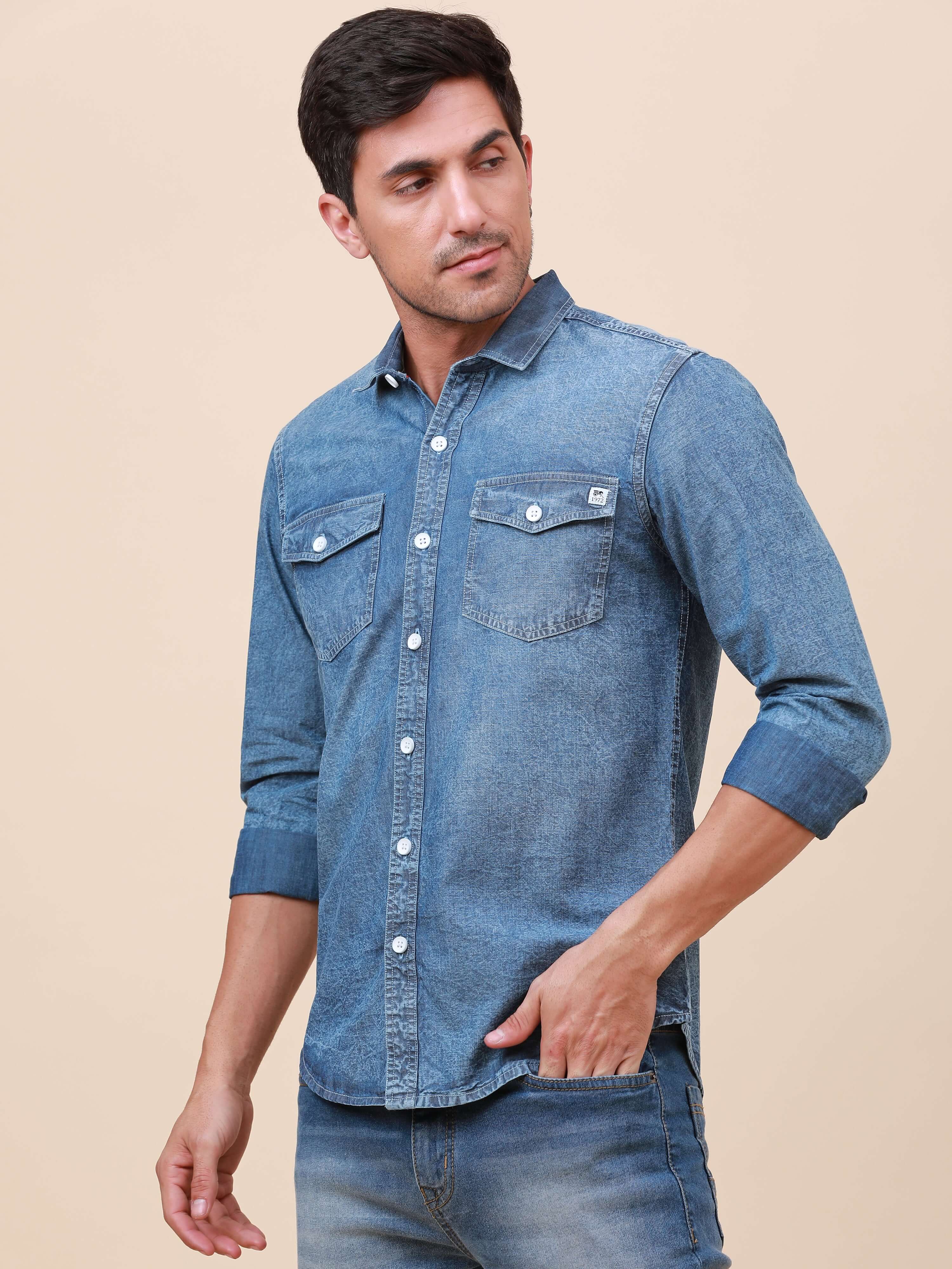 Denim Double Pocket Shirt shop online at Estilocus. Denim, Full-sleeve solid shirt Cut and sew placket Regular collar Double button edge cuff Double pocket with flap Curved bottom hemline All double needle construction, finest quality sewing Machine wash