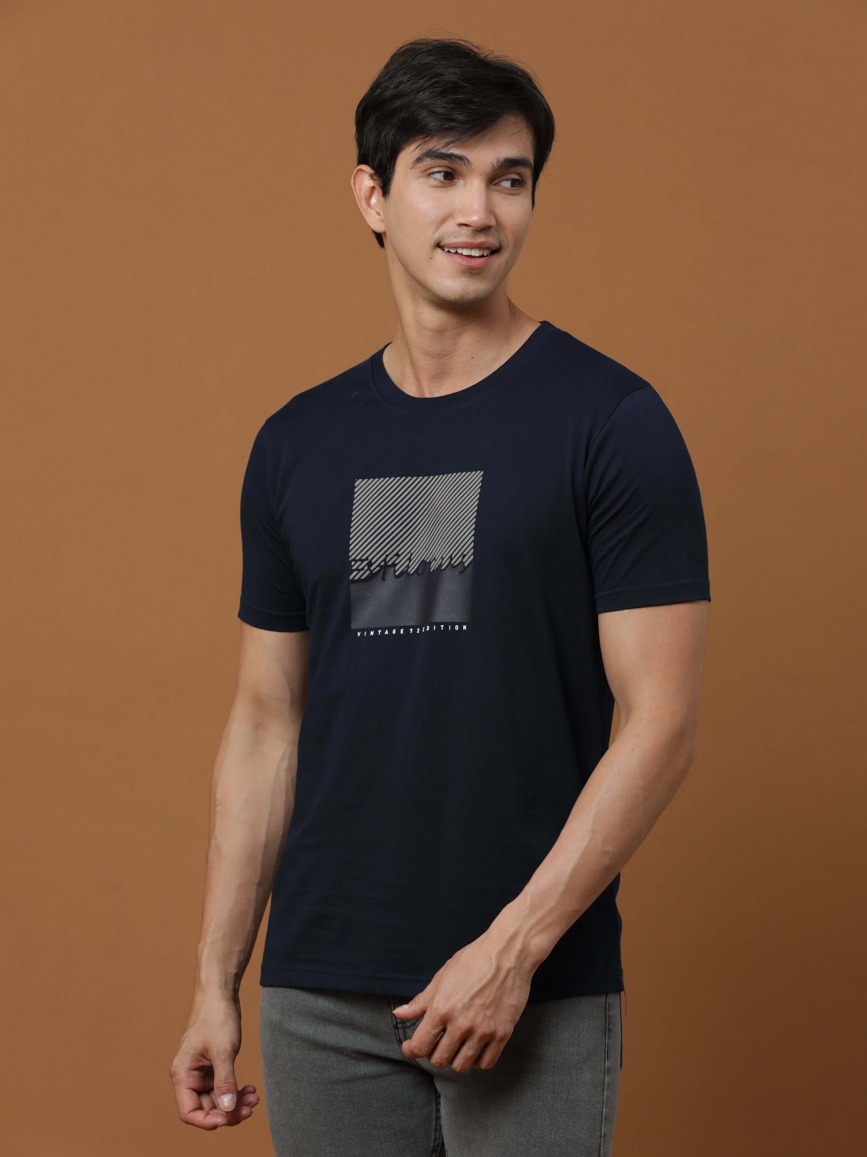 Navy Vintage 72 Edition T Shirt shop online at Estilocus. 100% Cotton Designed and printed on knitted fabric. The fabric is stretchy and lightweight, with a soft skin feel and no wrinkles. Crew neck collar which is smooth on the neck and keeps you comfort