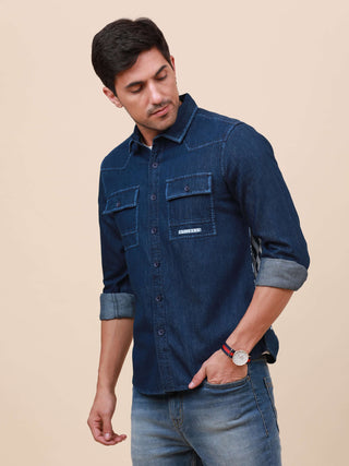 Indigo Denim Double Pocket Shirt shop online at Estilocus. Denim ,Full-sleeve shirt Cut and sew placket. Regular collar Double button edge cuff Double pocket with flap Curved bottom hemline Finest quality print at pocket All Double needle construction, fi