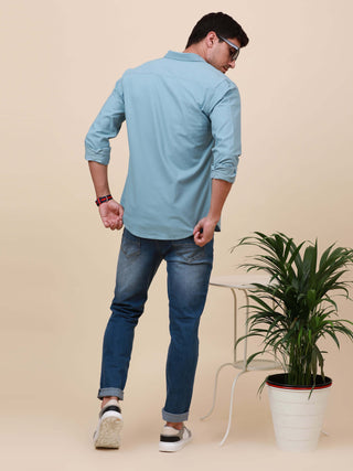 Pale Teal Solid Single Pocket Shirt shop online at Estilocus. 100% Cotton ,Full-sleeve solid shirt Cut and sew placket Regular collar Double button edge cuff Single pocket Curved bottom hemline HD elegant printing at front placket and pocket. All double n