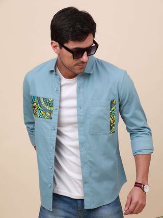 Pale Teal Solid Single Pocket Shirt shop online at Estilocus. 100% Cotton ,Full-sleeve solid shirt Cut and sew placket Regular collar Double button edge cuff Single pocket Curved bottom hemline HD elegant printing at front placket and pocket. All double n