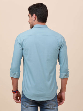 Pale Teal Solid Single Pocket Shirt shop online at Estilocus. 100% Cotton ,Full-sleeve solid shirt Cut and sew placket Regular collar Double button edge cuff Single pocket Curved bottom hemline HD elegant printing at front placket and pocket. All double n