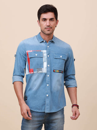 Blue Denim Double Pocket Shirt shop online at Estilocus. Denim ,Full-sleeve shirt cut and sew placket. Regular collar Double button edge cuff Double pocket with flap Curved bottom hemline HD elegant print @ panel All Double needle construction, finest qua