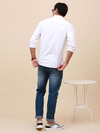 White Solid Single Pocket Shirt shop online at Estilocus. 100% Cotton ,Full-sleeve solid shirt Cut and sew placket Regular collar Double button edge cuff Single pocket Curved bottom hemline Finest printing at front placket. All double needle construction,