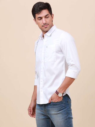 White Solid Single Pocket Shirt shop online at Estilocus. 100% Cotton ,Full-sleeve solid shirt Cut and sew placket Regular collar Double button edge cuff Single pocket Curved bottom hemline Finest printing at front placket. All double needle construction,