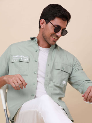 Mint Green Solid Double Pocket Shirt shop online at Estilocus. 100% Cotton , Full-sleeve solid shirt Cut and sew placket Regular collar Double button edge cuff Double pocket with flap Curved bottom hemline Finest printing at pocket . All double needle con