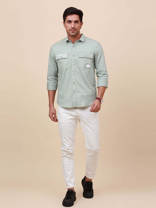 Mint Green Solid Double Pocket Shirt shop online at Estilocus. 100% Cotton , Full-sleeve solid shirt Cut and sew placket Regular collar Double button edge cuff Double pocket with flap Curved bottom hemline Finest printing at pocket . All double needle con