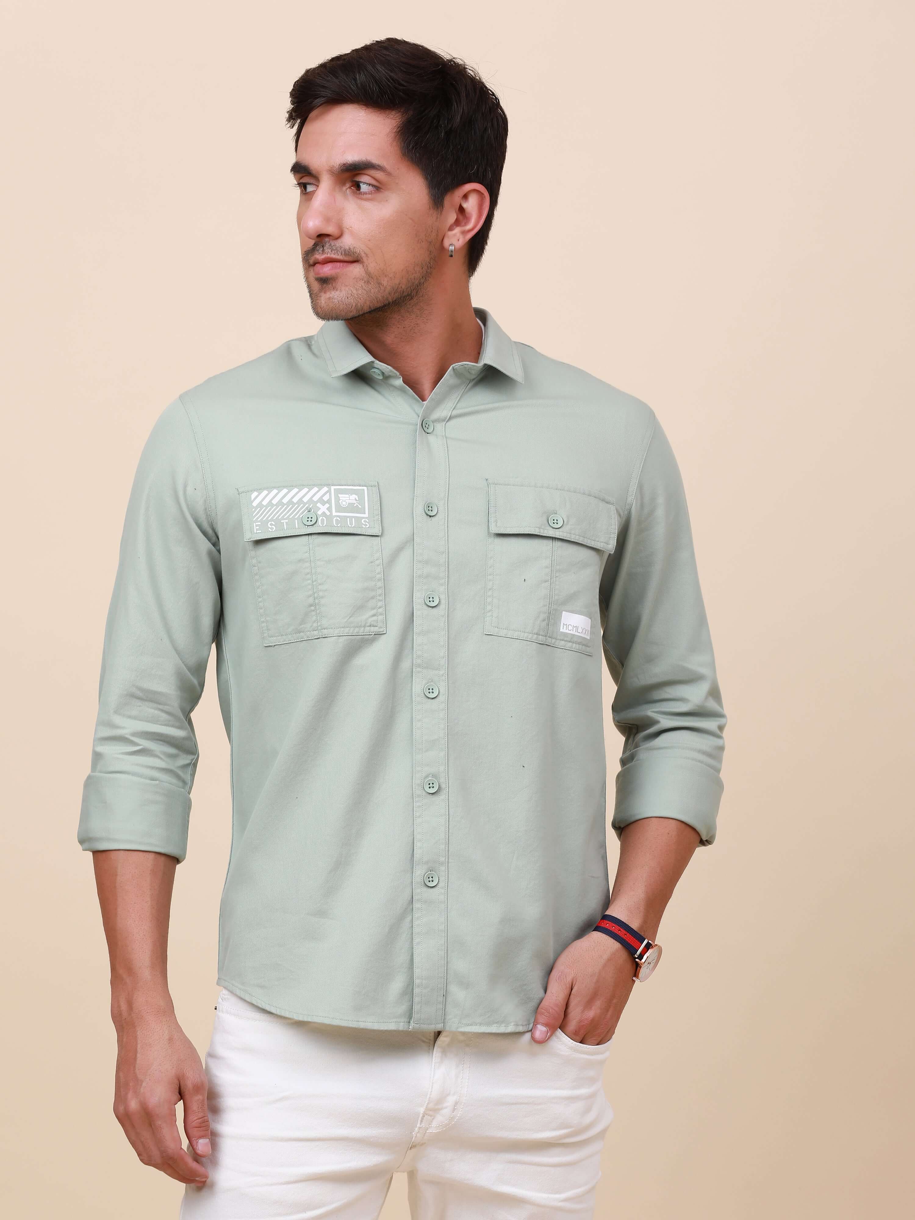 Mint Green Solid Double Pocket Shirt shop online at Estilocus. 100% Cotton , Full-sleeve solid shirt Cut and sew placket Regular collar Double button edge cuff Double pocket with flap Curved bottom hemline Finest printing at pocket . All double needle con