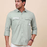 Mint Green Solid Double Pocket Shirt shop online at Estilocus. 100% Cotton , Full-sleeve solid shirt Cut and sew placket Regular collar Double button edge cuff Double pocket with flap Curved bottom hemline Finest printing at pocket . All double needle con