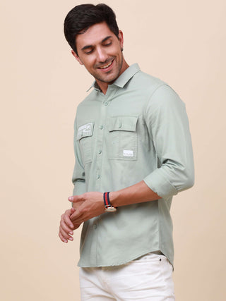 Mint Green Solid Double Pocket Shirt shop online at Estilocus. 100% Cotton , Full-sleeve solid shirt Cut and sew placket Regular collar Double button edge cuff Double pocket with flap Curved bottom hemline Finest printing at pocket . All double needle con