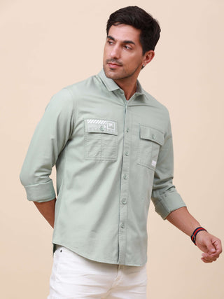 Mint Green Solid Double Pocket Shirt shop online at Estilocus. 100% Cotton , Full-sleeve solid shirt Cut and sew placket Regular collar Double button edge cuff Double pocket with flap Curved bottom hemline Finest printing at pocket . All double needle con