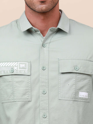 Mint Green Solid Double Pocket Shirt shop online at Estilocus. 100% Cotton , Full-sleeve solid shirt Cut and sew placket Regular collar Double button edge cuff Double pocket with flap Curved bottom hemline Finest printing at pocket . All double needle con