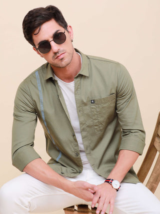 Olive Green Solid Single Pocket Shirt shop online at Estilocus. 100% Cotton ,Full-sleeve solid shirt Cut and sew placket Regular collar Double button edge cuff Single pocket Curved bottom hemline Finest printing at front placket. All double needle constru