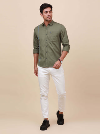 Olive Green Solid Single Pocket Shirt shop online at Estilocus. 100% Cotton ,Full-sleeve solid shirt Cut and sew placket Regular collar Double button edge cuff Single pocket Curved bottom hemline Finest printing at front placket. All double needle constru