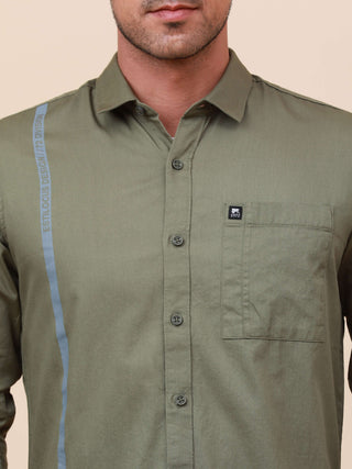 Olive Green Solid Single Pocket Shirt shop online at Estilocus. 100% Cotton ,Full-sleeve solid shirt Cut and sew placket Regular collar Double button edge cuff Single pocket Curved bottom hemline Finest printing at front placket. All double needle constru