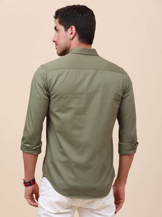 Olive Green Solid Single Pocket Shirt shop online at Estilocus. 100% Cotton ,Full-sleeve solid shirt Cut and sew placket Regular collar Double button edge cuff Single pocket Curved bottom hemline Finest printing at front placket. All double needle constru