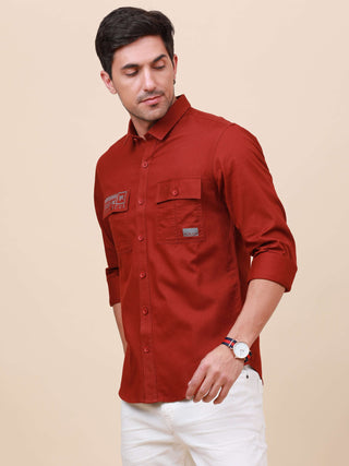 Rust Brown Solid Double Pocket Shirt shop online at Estilocus. 100% Cotton , Full-sleeve solid shirt Cut and sew placket Regular collar Double button edge cuff Double pocket with flap Curved bottom hemline Finest printing at pocket . All double needle con