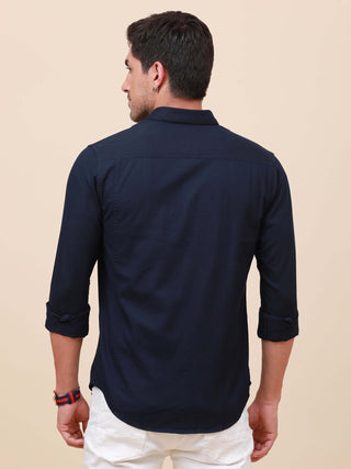 Dark Navy Solid Double Pocket Shirt shop online at Estilocus. 100% Cotton , Full-sleeve solid shirt Cut and sew placket Regular collar Double button edge cuff Double pocket with flap Curved bottom hemline Finest printing at pocket . All double needle cons