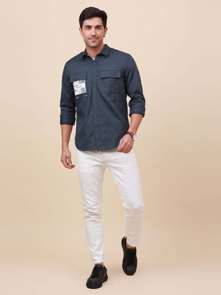 Navy Solid Double Pocket Shirt shop online at Estilocus. 100% Cotton ,Full-sleeve solid shirt Cut and sew placket Regular collar Double button edge cuff Double pocket Curved bottom hemline Finest printing at front placket. All double needle construction,