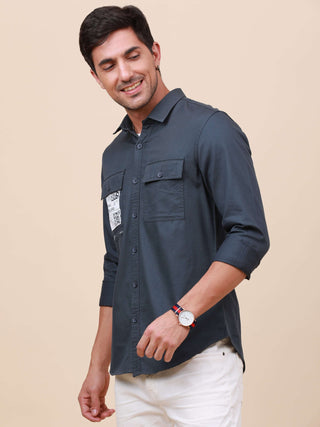 Navy Solid Double Pocket Shirt shop online at Estilocus. 100% Cotton ,Full-sleeve solid shirt Cut and sew placket Regular collar Double button edge cuff Double pocket Curved bottom hemline Finest printing at front placket. All double needle construction,