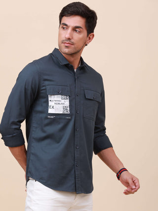 Navy Solid Double Pocket Shirt shop online at Estilocus. 100% Cotton ,Full-sleeve solid shirt Cut and sew placket Regular collar Double button edge cuff Double pocket Curved bottom hemline Finest printing at front placket. All double needle construction,