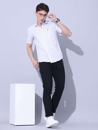 White Small Checks Casual Shirt shop online at Estilocus. • Half-sleeve small checks shirt • Cut and sew a placket. • Regular collar • Single pocket with logo embroidery • Curved hemline • Finest quality sewing • Machine wash care • Suitable to wear with