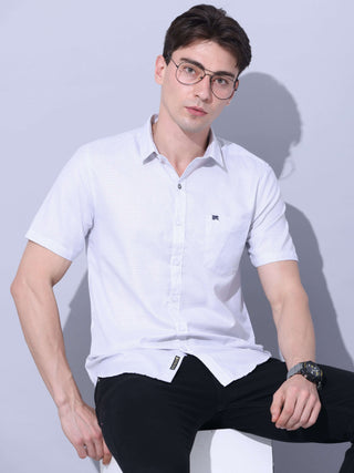 White Small Checks Casual Shirt shop online at Estilocus. • Half-sleeve small checks shirt • Cut and sew a placket. • Regular collar • Single pocket with logo embroidery • Curved hemline • Finest quality sewing • Machine wash care • Suitable to wear with