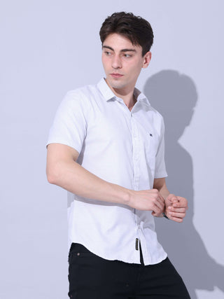 White Small Checks Casual Shirt shop online at Estilocus. • Half-sleeve small checks shirt • Cut and sew a placket. • Regular collar • Single pocket with logo embroidery • Curved hemline • Finest quality sewing • Machine wash care • Suitable to wear with