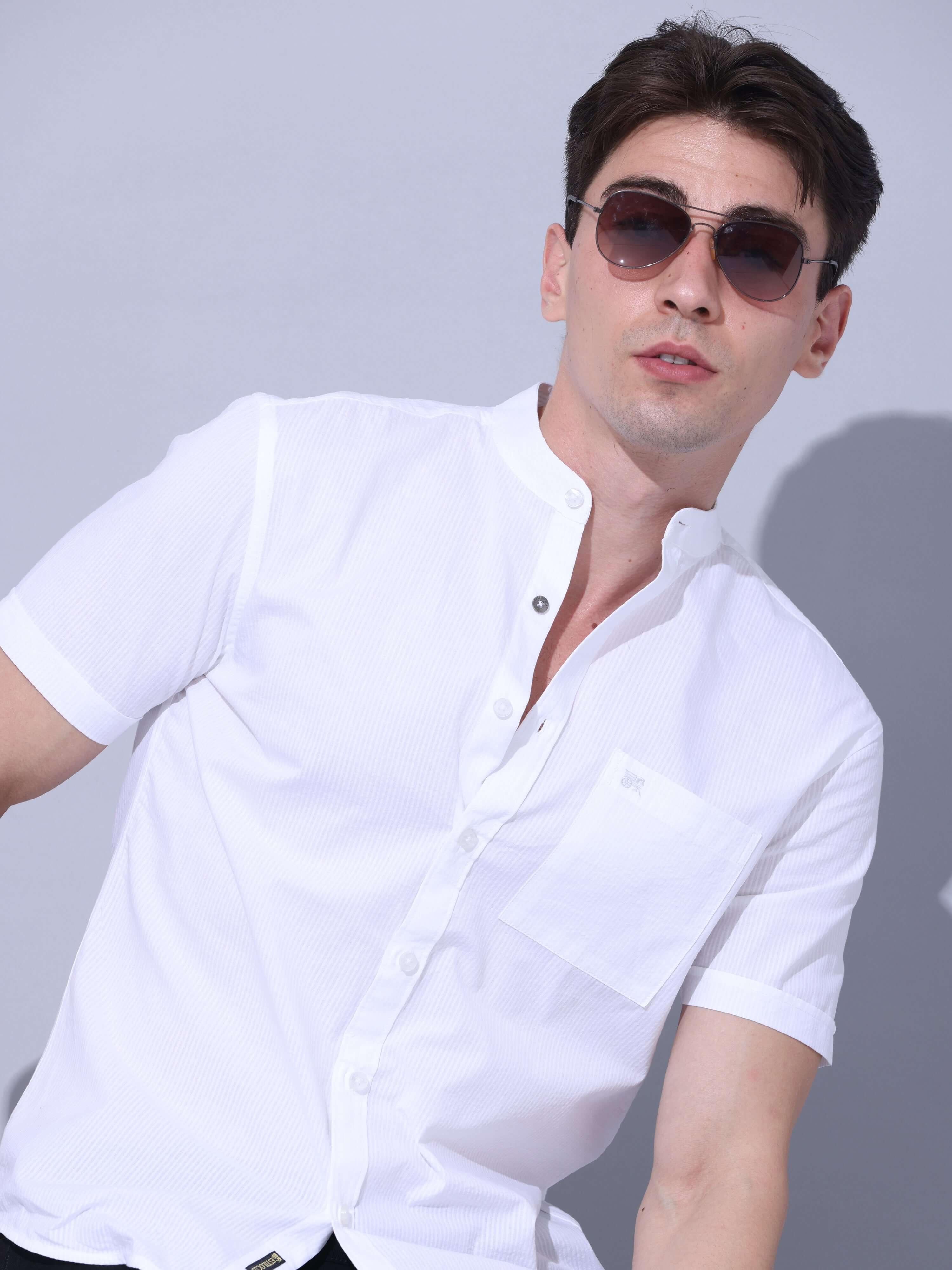 White Casual Shirt shop online at Estilocus. • Half-sleeve solid stripe shirt • Cut and sew placket • Regular collar • Single pocket with logo embroidery • Curved hemline • Finest quality sewing • Machine wash care • Suitable to wear with all types of bot