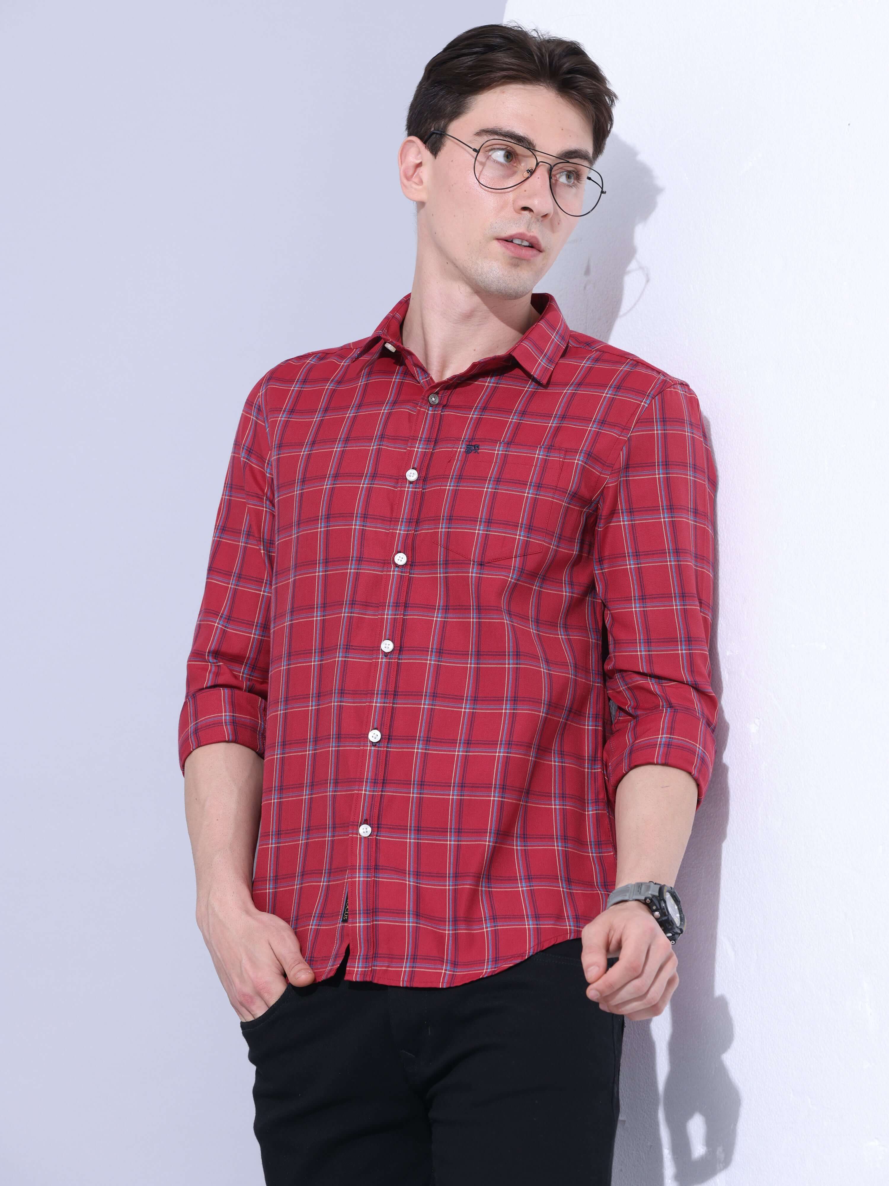 Red Checks Casual Shirt shop online at Estilocus. • Full-sleeve check shirt • Cut and sew placket • Regular collar • Double button square cuff. • Single pocket with logo embroidery • Curved hemline • Finest quality sewing • Machine wash care • Suitable to