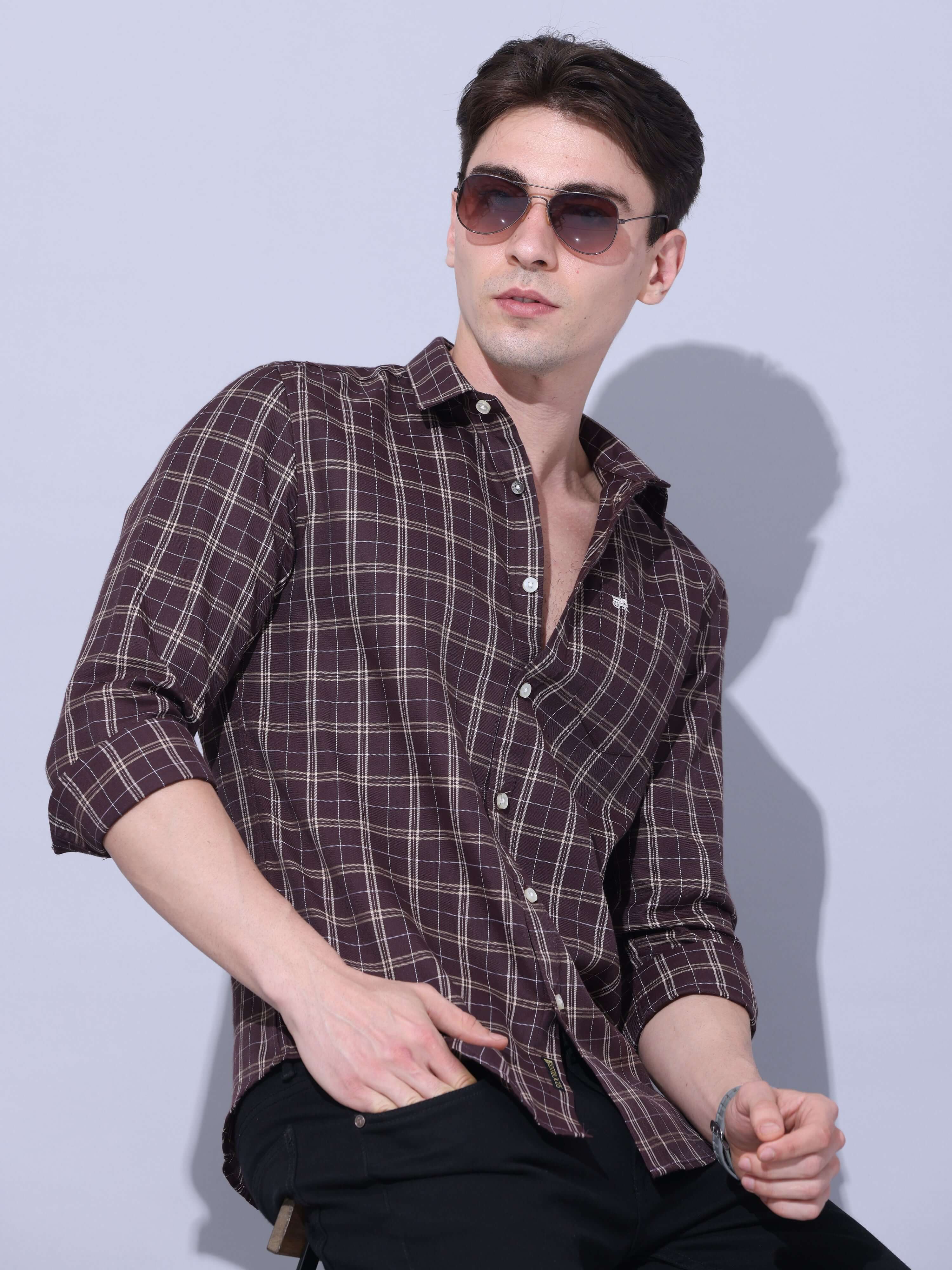 Brown Checks Casual Shirt shop online at Estilocus. • Full-sleeve check shirt • Cut and sew placket • Regular collar • Double button square cuff. • Single pocket with logo embroidery • Curved hemline • Finest quality sewing • Machine wash care • Suitable