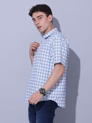 Light Blue Check Casual Shirt shop online at Estilocus. • Checkered half sleeve shirt with regular collar and curved hem. • Single pocket with logo embroidery • Finest quality sewing • Machine wash care • Suitable to wear with all types of bottoms • Made