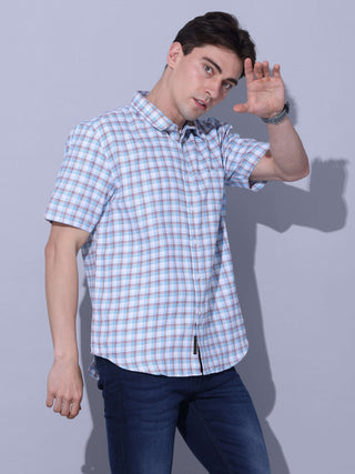 Light Blue Check Casual Shirt shop online at Estilocus. • Checkered half sleeve shirt with regular collar and curved hem. • Single pocket with logo embroidery • Finest quality sewing • Machine wash care • Suitable to wear with all types of bottoms • Made