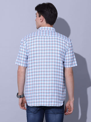 Light Blue Check Casual Shirt shop online at Estilocus. • Checkered half sleeve shirt with regular collar and curved hem. • Single pocket with logo embroidery • Finest quality sewing • Machine wash care • Suitable to wear with all types of bottoms • Made