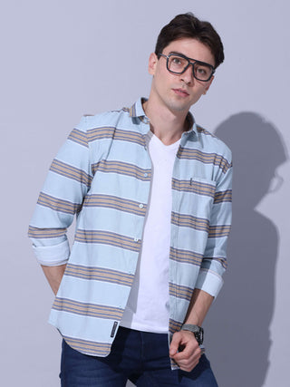 Powder Blue Stripe Casual Shirt shop online at Estilocus. •Powder blue full-sleeve stripe shirt • Cut and sew placket • Regular collar • Double button square cuff. • Single pocket with logo embroidery • Curved hemline • Machine wash care • Suitable to wea