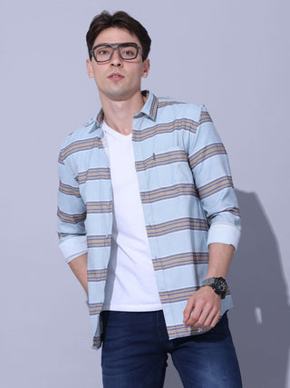 Powder Blue Stripe Casual Shirt shop online at Estilocus. •Powder blue full-sleeve stripe shirt • Cut and sew placket • Regular collar • Double button square cuff. • Single pocket with logo embroidery • Curved hemline • Machine wash care • Suitable to wea