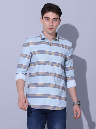 Powder Blue Stripe Casual Shirt shop online at Estilocus. •Powder blue full-sleeve stripe shirt • Cut and sew placket • Regular collar • Double button square cuff. • Single pocket with logo embroidery • Curved hemline • Machine wash care • Suitable to wea