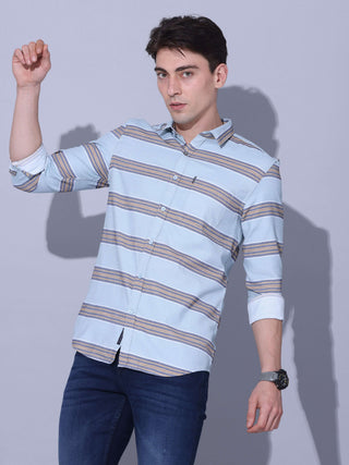 Powder Blue Stripe Casual Shirt shop online at Estilocus. •Powder blue full-sleeve stripe shirt • Cut and sew placket • Regular collar • Double button square cuff. • Single pocket with logo embroidery • Curved hemline • Machine wash care • Suitable to wea