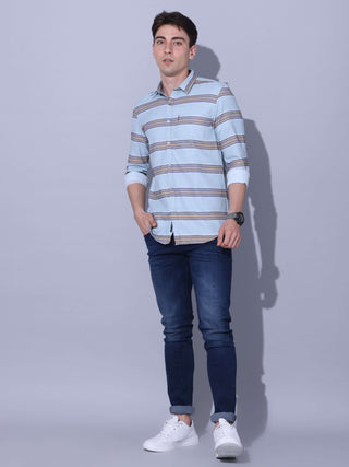 Powder Blue Stripe Casual Shirt shop online at Estilocus. •Powder blue full-sleeve stripe shirt • Cut and sew placket • Regular collar • Double button square cuff. • Single pocket with logo embroidery • Curved hemline • Machine wash care • Suitable to wea