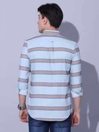 Powder Blue Stripe Casual Shirt shop online at Estilocus. •Powder blue full-sleeve stripe shirt • Cut and sew placket • Regular collar • Double button square cuff. • Single pocket with logo embroidery • Curved hemline • Machine wash care • Suitable to wea