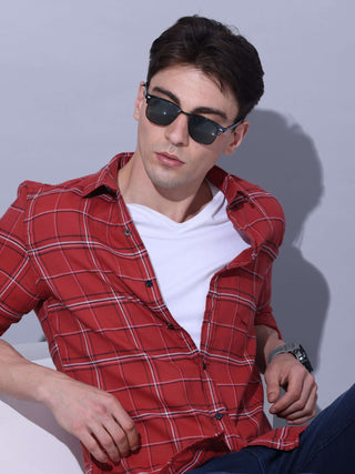 Red Check Casual Shirt shop online at Estilocus. • Checkered full sleeve shirt with regular collar and curved hem • Cut and sew placket • Double button square cuff • Single pocket with logo embroidery • Finest quality sewing • Suitable to wear with all ty