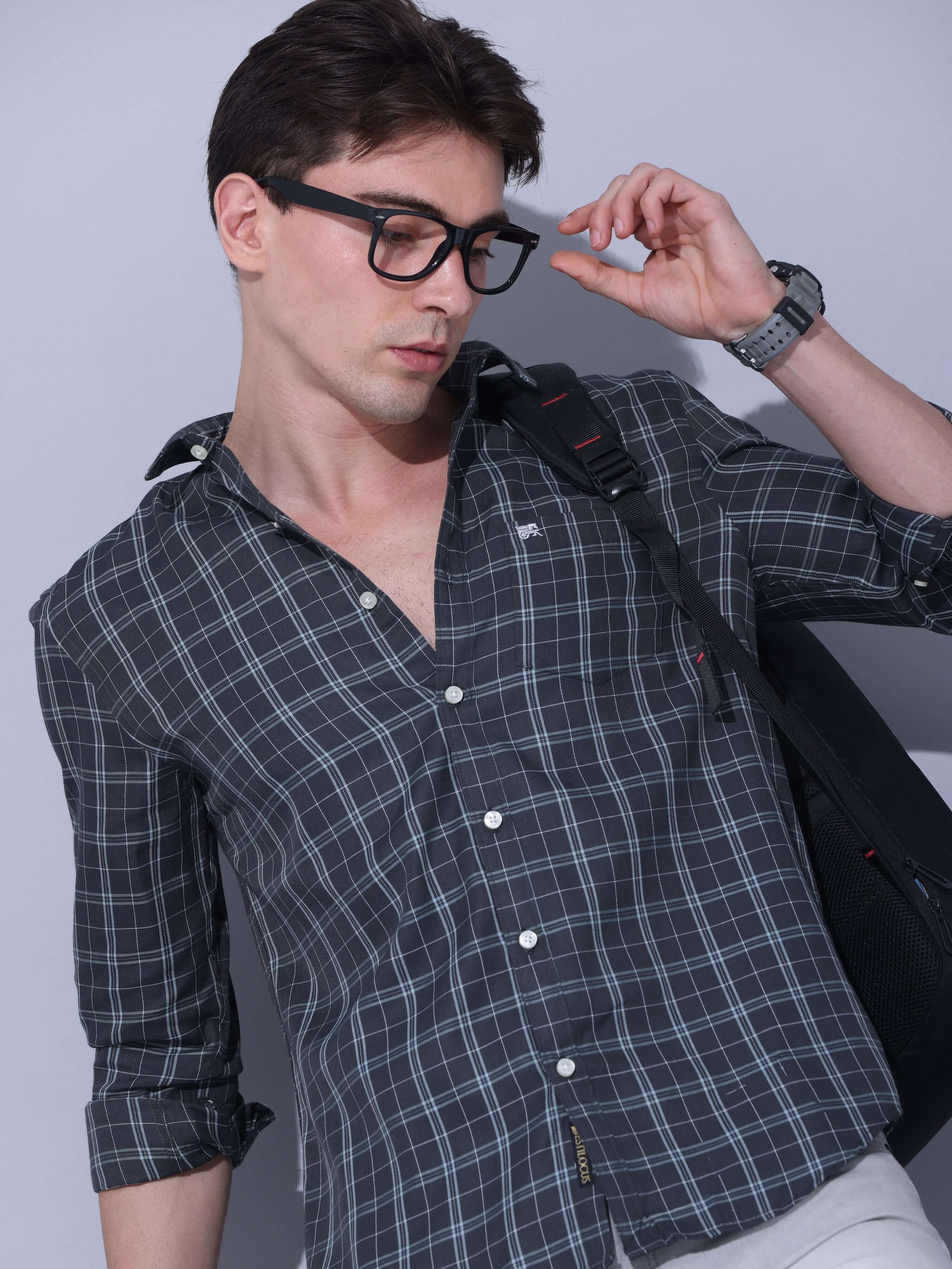Green Checks Casual Shirt shop online at Estilocus. • Full-sleeve check shirt • Cut and sew placket • Regular collar • Double button square cuff. • Single pocket with logo embroidery • Curved hemline • Finest quality sewing • Machine wash care • Suitable