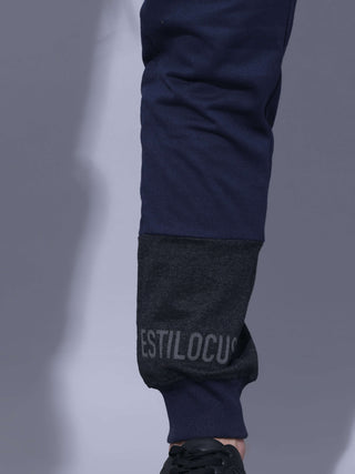 Joggers With Adjustable Draw String shop online at Estilocus. •High GSM knitted breathable fabric. •Elastic waistband with an adjustable drawcord secures your fit • Bottom rib with patchwork fabric with finest quality print unique design. • Insert pocket